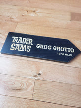 large Custom Directional sign with distance from your home to trader sam's grog grotto