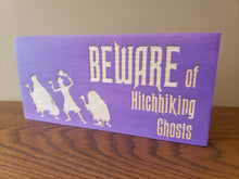 Beware of Hitchhiking Ghosts wood door sign