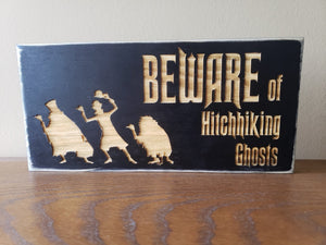 Beware of Hitchhiking Ghosts wood door sign