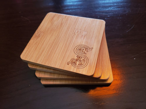 set of 4 society of explorers and adventurers themed bamboo coasters